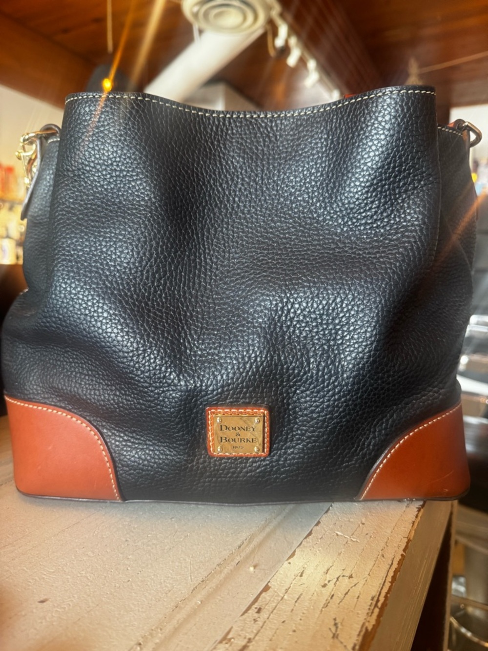 Dooney & Bourke Black Leather Tote with Brown Trim and Handles - Picture 3 of 10